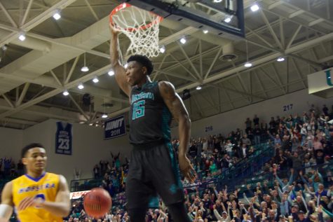 Devontae Cacok (15) delivers his final dunk in Trask Coliseum during UNCW's 87-79 Senior Day win over Hofstra on Feb. 16, 2019.