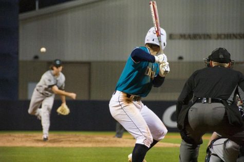 Doug Angeli (4) bats during UNCW's matchup against Coastal Carolina on Feb. 19, 2019 at Brooks Field.