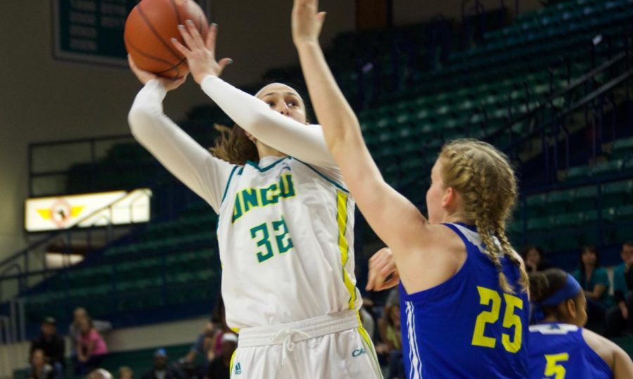 Carol-Anne Obusek (32) attempts a hook shot during UNCWs contest against Delaware in Trask Coliseum on Feb. 24, 2019. 