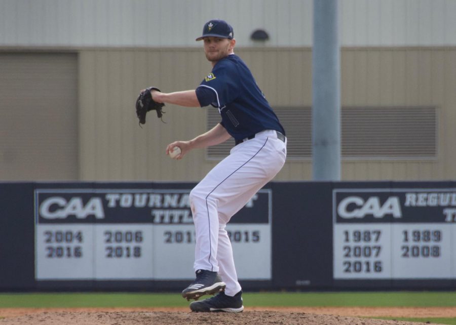 Blake Deatherage (11) pitches during UNCW's matchup against Valparaiso at Brooks Field on March 3, 2019.