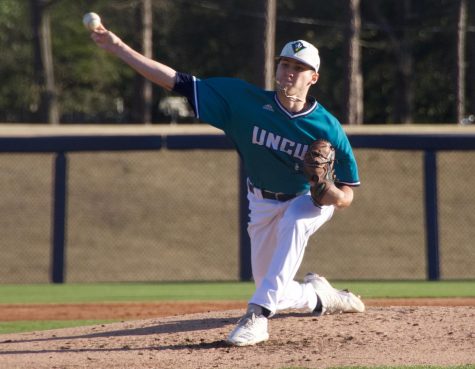 Landen Roupp (14) pitches during UNCW's matchup against Toledo on Wednesday night at Brooks Field.
