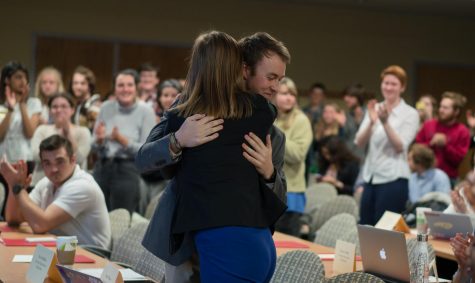 Appalachian State students embrace after the school's student government passed a Climate Neutrality bill on March 13.