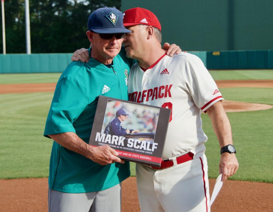 NC State coach Elliott Avent (right) honors UNCW coach Mark Scalf (left) prior to Tuesdays game at Doak Field on April 30, 2019.