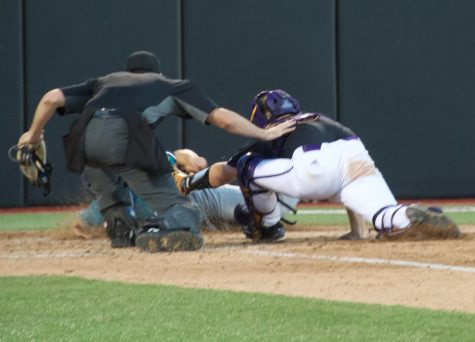 Doug Angeli slides home at Clark-LeClair Stadium on April 23, 2019.