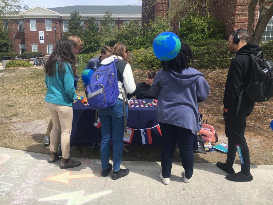 Student Ambassadors table for DIVE IN week on Chancellor's Walk on Monday.