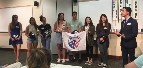 Christopher Cardona, far right, the Peace Corps Regional Recruiter at UNCW, speaks to several volunteers on Wednesday at a sendoff for UNCW Peace Corps student volunteers.