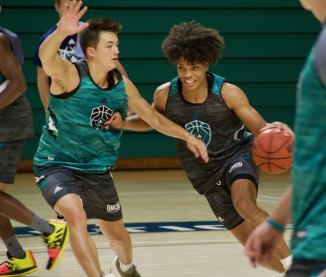 Kai Toews guards Shykeim Phillips during UNCW's first official practice of the 2019-20 season on Sep. 26, 2019.