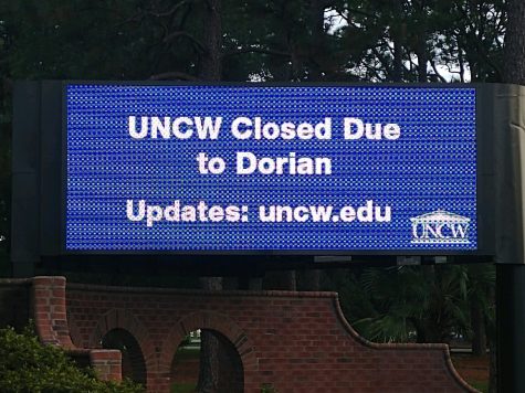 UNCW digital info sign on South College Road announcing campus closure due to Hurricane Dorian,