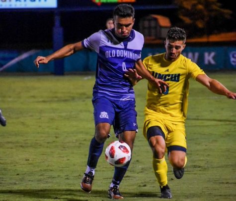 Alejandro Saez (18) battles with Old Dominion defender Jose Olmos (4) during UNCW's matchup with the Monarchs on October 9, 2019 at UNCW Soccer Stadium