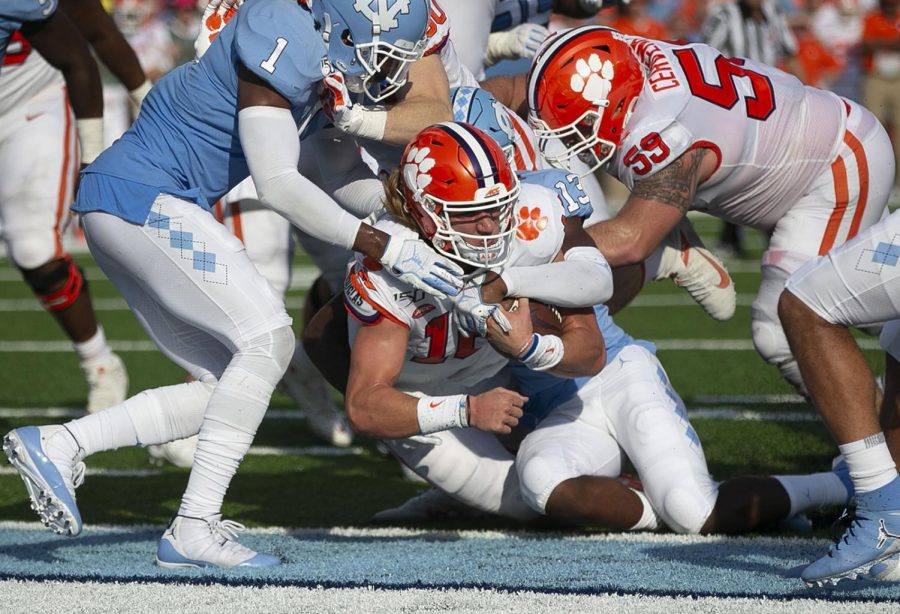 
Clemson quarterback Trevor Lawrence (16) scores a touchdown on a three-yard run to tie North Carolina 14-14 in the second quarter on Saturday, September 28, 2019 at Kenan Stadium in Chapel Hill, N.C.