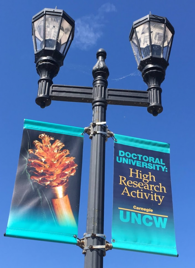 A sign on Chancellor’s Walk indicating UNCW’s honorable designation by the Carnegie Classification of Institutions of Higher Education.