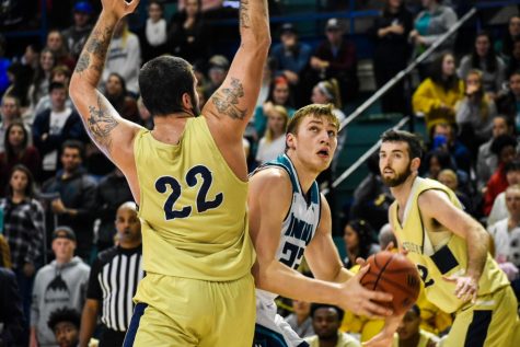 Marten Linssen attempts to go up for a shot during UNCW's matchup with N.C. Wesleyan on Nov. 19, 2019.