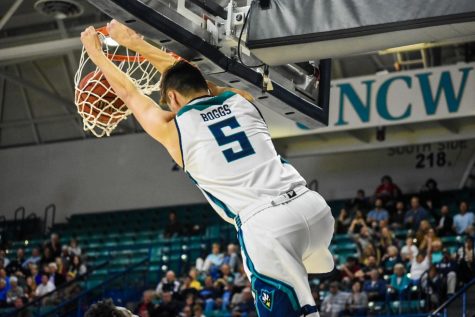 Jake Boggs slams one down during UNCW's matchup with N.C. Wesleyan on Nov. 19, 2019.
