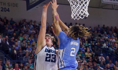 Marten Linssen (23) attempts to shoot over Cole Anthony (2) during UNCW's matchup with North Carolina on Nov. 8, 2019 at Trask Coliseum.