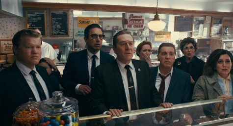 From left to right, during a break in the trial of Jimmy Hoffa, Chuckie O'Brien (Jesse Plemons), Bill Bufalino (Ray Romano), Frank Sheeran (Robert De Niro) and Hoffa (Al Pacino) are shocked at the news of JFK's assassination in a scene from