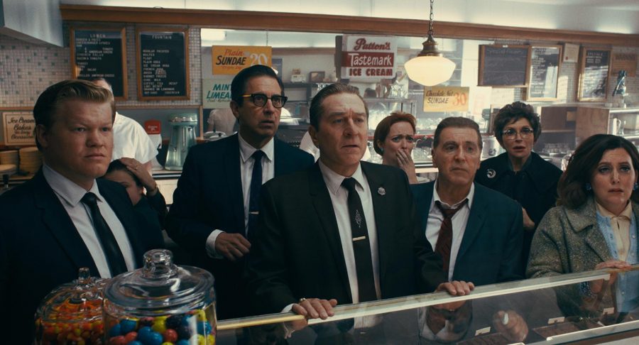 From left to right, during a break in the trial of Jimmy Hoffa, Chuckie O'Brien (Jesse Plemons), Bill Bufalino (Ray Romano), Frank Sheeran (Robert De Niro) and Hoffa (Al Pacino) are shocked at the news of JFK's assassination in a scene from 