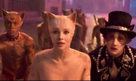 Francesca Hayward as Victoria, center, and Laurie Davidson as Mr. Mistoffelees, right, in 'Cats.' (Universal Pictures/TNS)