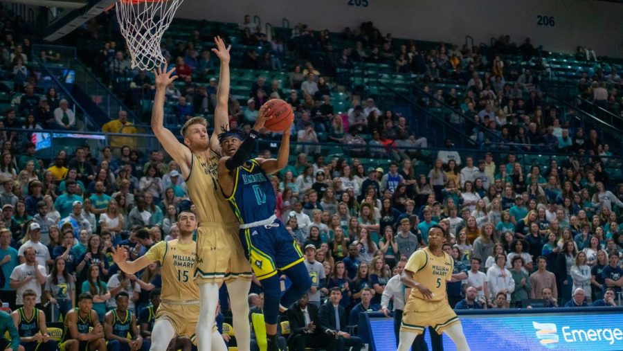 Ty Gadsden (0) attempts to shoot against a defender during UNCW's homecoming matchup against William & Mary on Feb. 8, 2020 at Trask Coliseum.