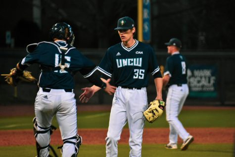 From left: Matt Suggs (15), Adam Smith (35) and Cole Weiss (8) during UNCW's matchup with Marshall on Feb. 23, 2020 at Brooks Field.