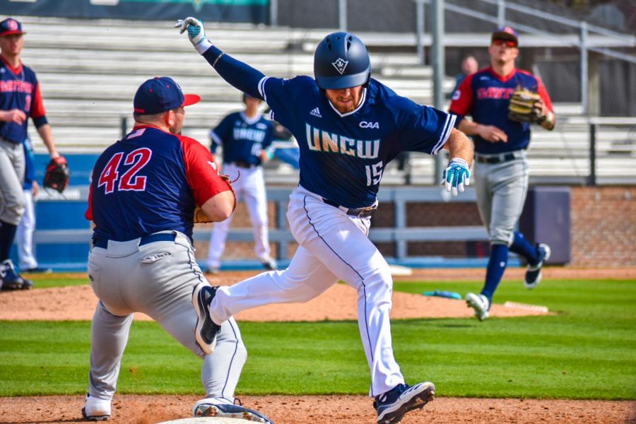 Matt Suggs (15) crosses first base during UNCWs matchup with Dayton on Feb. 16, 2020 at Brooks Field