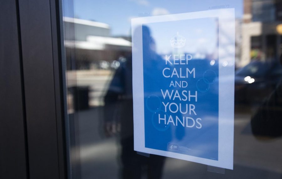 A sign on the front door of Jackson City Hall encourages hand washing on Friday, March 13, 2020.