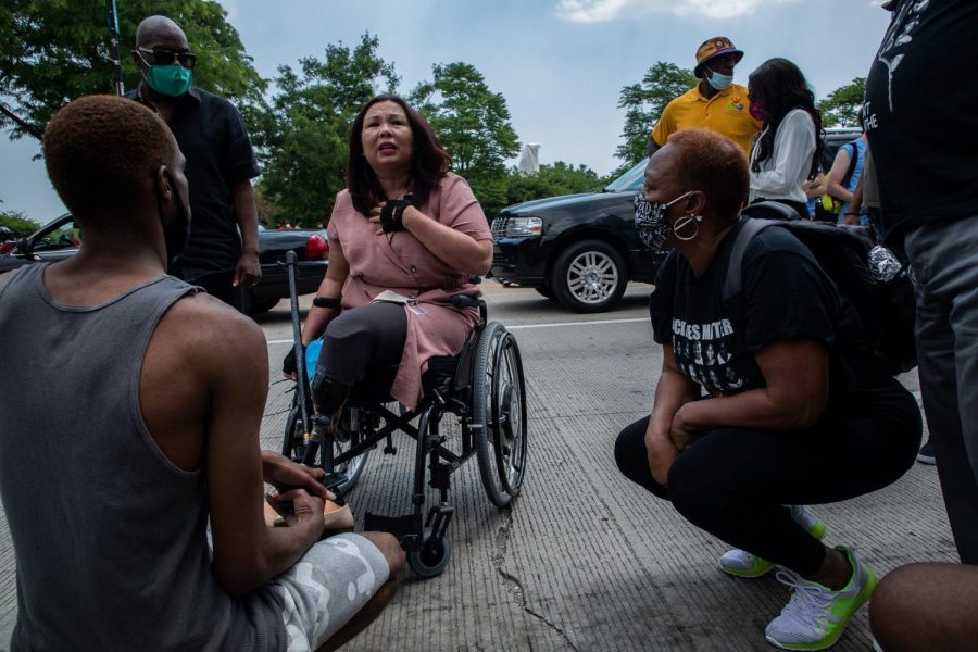 U.S. Sen. Tammy Duckworth talks with marchers before a Juneteenth march on on Columbus Drive in Grant Park on June 19, 2020.
