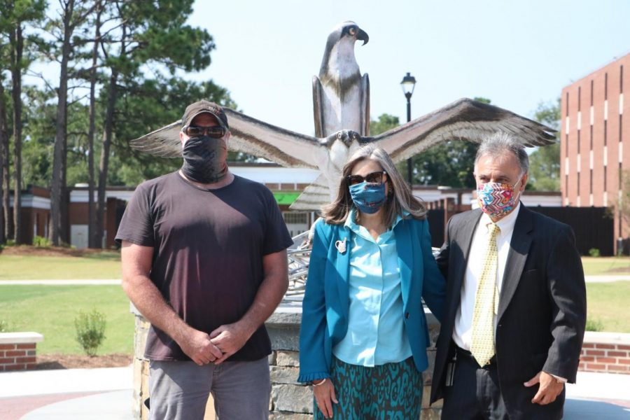 The artist Dumay Gorham; Mrs. Katherine Sartarelli; Chancellor Jose V. Sartarelli in front of the new sculpture. 
