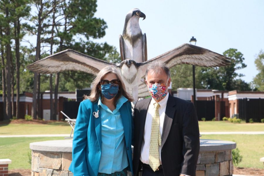 Mrs. Katherine Sartarelli and UNCW Chancellor Jose V. Sartarelli in front of the new sculpture. 