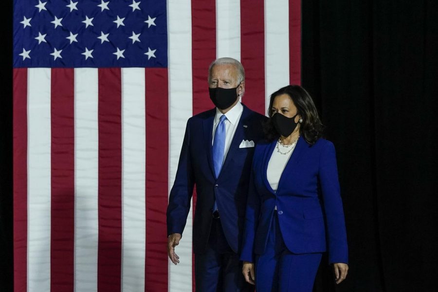 Democratic+presidential+nominee+former+Vice+President+Joe+Biden%2C+left%2C+and+running+mate+Sen.+Kamala+Harris+%28D-CA%29+take+the+stage+to+deliver+remarks+at+Alexis+Dupont+High+School+in+Wilmington%2C+Delaware%2C+on+Wednesday%2C+Aug.+12%2C+2020.+The+pair+will+be+regularly+tested+for+coronavirus+as+campaigning+intensifies+in+the+weeks+before+the+election.+%28Drew+Angerer%2FGetty+Images%2FTNS%29