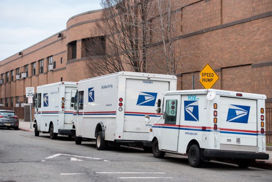 USPS trucks parked on Cambridge Avenue behind the Central Avenue post office and behind the Christa McAuliffe School PS 28 in the Heights section of Jersey City, Monday, Jan. 27, 2020