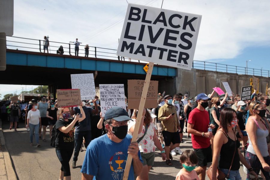 People march in support of Jacob Blake and his family to the Kenosha County Courthouse on Saturday, Aug. 29, 2020, in Kenosha, Wisconsin. Blake was shot seven times in the back in front of his three children by a police officer in Kenosha. (Scott Olson/Getty Images/TNS)