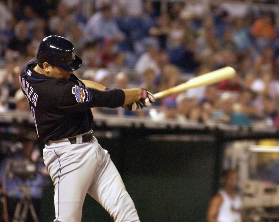 Mike Piazza swinging at a pitch in a game for the New York Mets (Photo by Gerald S. Williams)