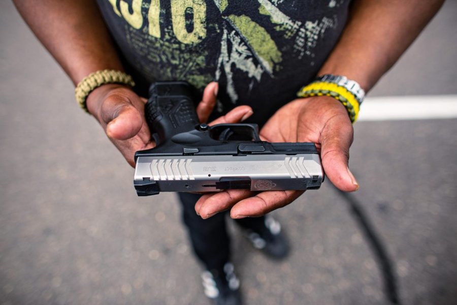 MINNEAPOLIS, MN - JULY 25: Reverend Tim Christopher, hold his firearm that he always carries while attending the meet-and-greet event held Minnesota Freedom Fighters on Saturday, July 25, 2020 in Minneapolis, MN. Christopher has testified before the MN House Judiciary Committee on gun control legislation. (Jason Armond/Los Angeles Times/TNS)