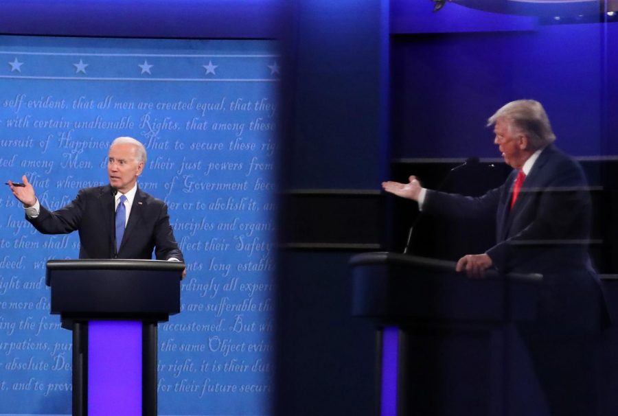 Democratic presidential nominee Joe Biden and U.S. President Donald Trump, shown in a reflection, participate in the final presidential debate at Belmont University on October 22, 2020 in Nashville, Tennessee. This is the last debate between the two candidates before the election on November 3. (Chip Somodevilla/Getty Images/TNS)
