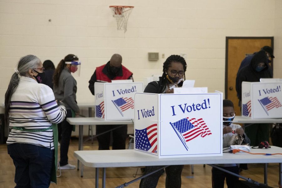 India Richburg votes with her son Nash Waiters, 4, at the North Springs 2 voting location in Columbia, South Carolina on Tuesday, Nov. 3, 2020. "In and out in five minutes, tops," Richburg said, describing how long it took to vote. 
