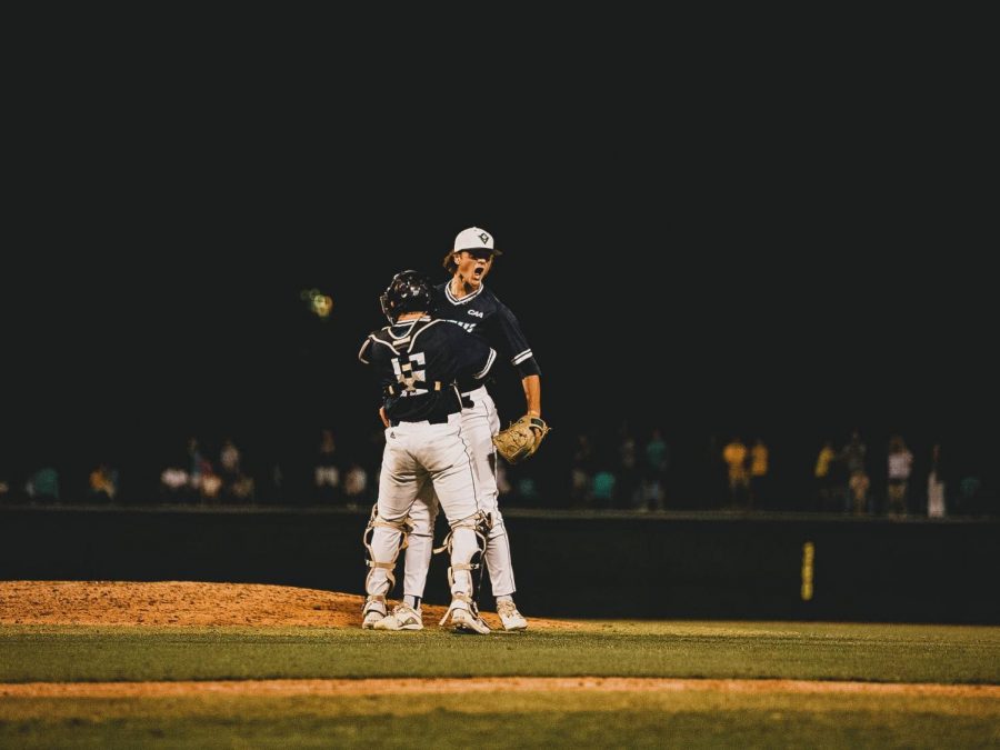 Ethan Chenault and Matt Suggs after UNCW's win over Northeastern on May 28, 2021.