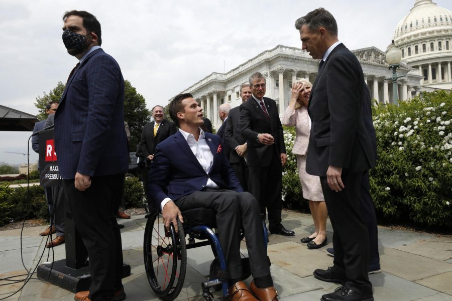 North Carolina Rep. Madison Cawthorn and Indiana Rep. Jim Banks chat before former U.S. Secretary of State Mike Pompeo introduces the Maximum Pressure Act against Iran on Capitol Hill in Washington, D.C. on Wednesday, April 21, 2021. 