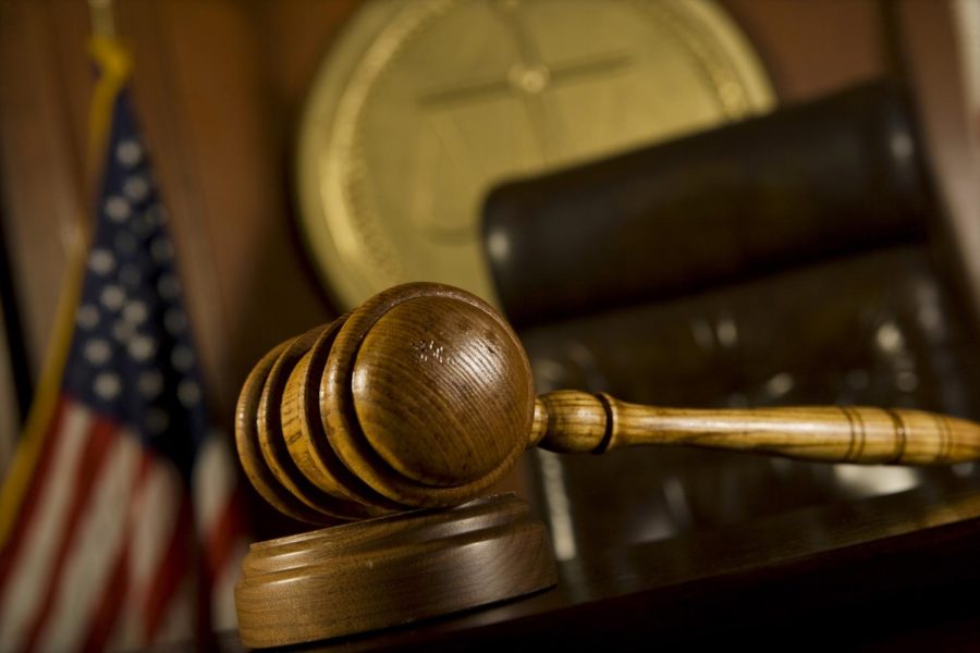 A closeup of a gavel in court.