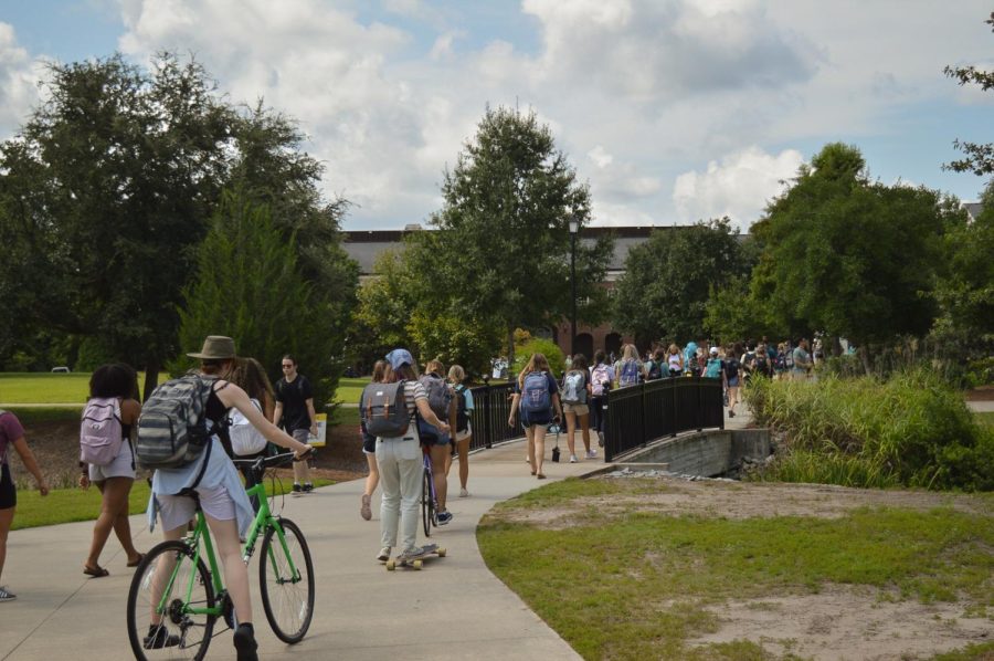 Students head to class across the bridge.
