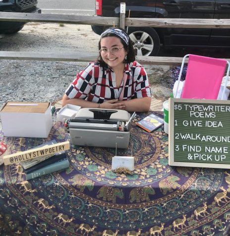 Holly Walker sets up a table to sell typewriter poems.