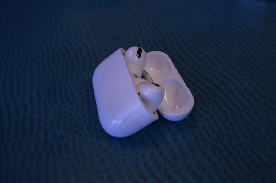 Audrey uses Apple AirPods to listen to music.