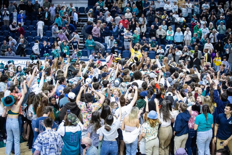 Students celebrate Saturday’s victory over James Madison at Trask Coliseum.
