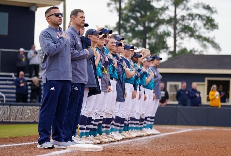 UNCW Softball during the pregame national anthem at Boseman Field.