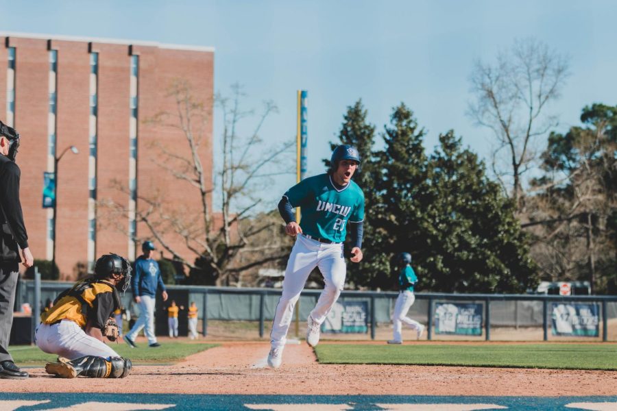 Chris Thorburn scoring the winning run for UNCW in a victory over Kennesaw State on Mar. 13, 2022 at Brooks Field.