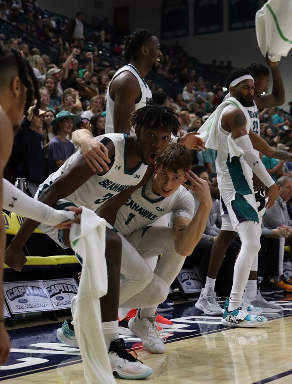 Maleeck Harden-Hayes and Eric Van Der Heijden celebrate during a game at Trask Coliseum. Photo by Paige OShields.