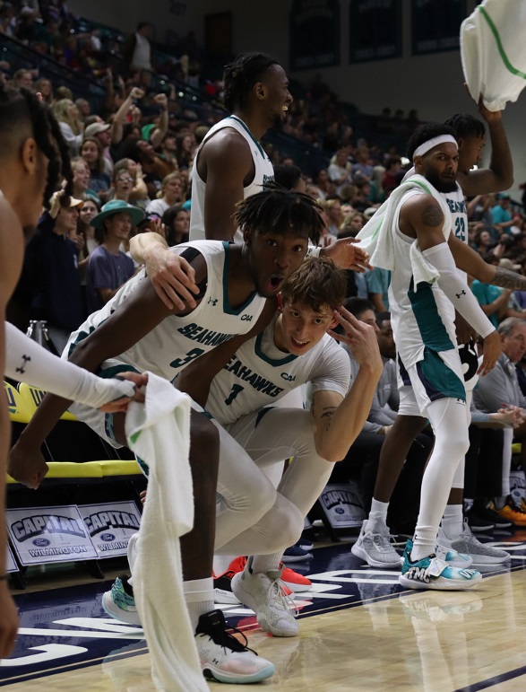 Maleeck Harden-Hayes and Eric Van Der Heijden celebrate during a game at Trask Coliseum. Photo by Paige O'Shields.