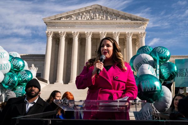 Lorie Smith, a Christian graphic artist and website designer in Colorado, addresses supporters outside the Supreme Court on Dec. 5, 2022, in Washington, D.C. (Kent Nishimura/Los Angeles Times/TNS)