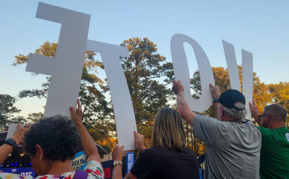 "VOTE NC" - Rally goers hold letters spelling out "VOTE NC," encouraging North Carolinians to head to the polls. (Emily Reier/The Seahawk)