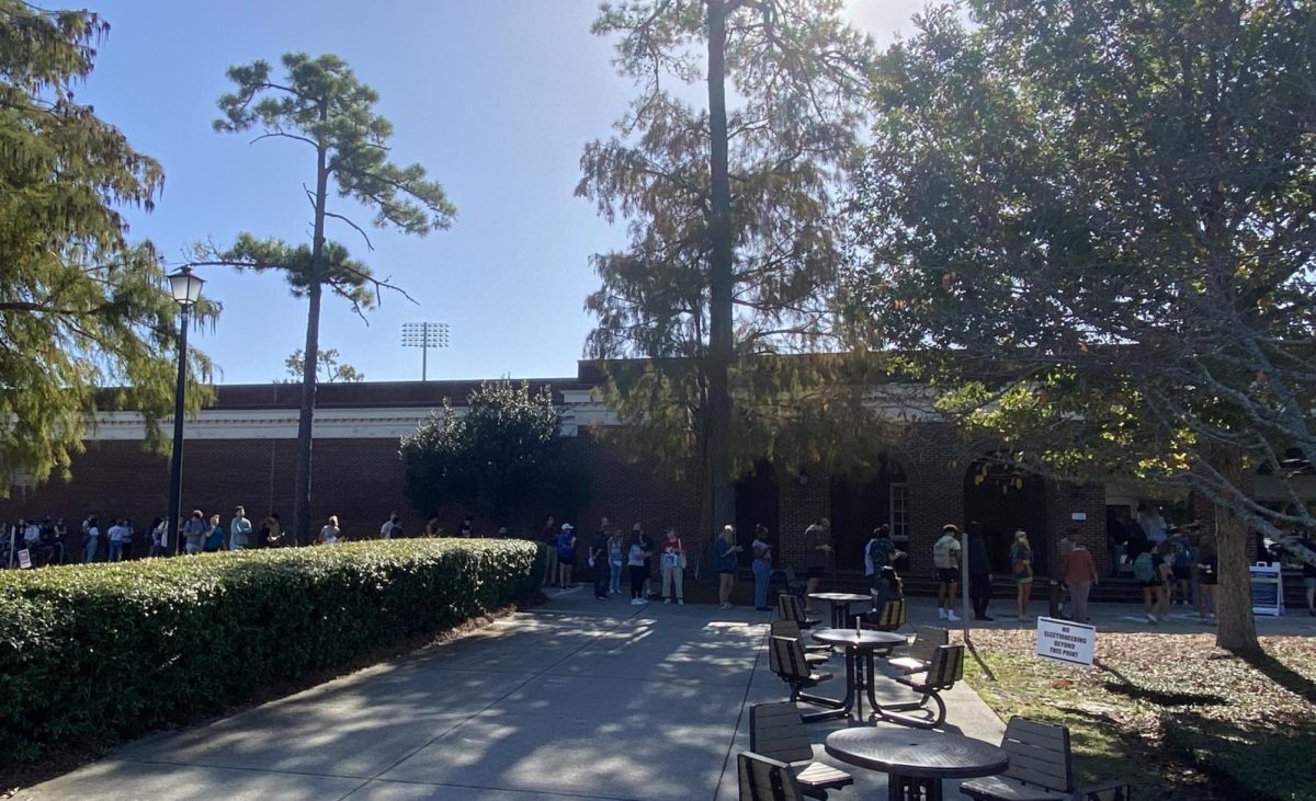 Lines wrap around Warwick - By 12:00, the Warwick Center saw steady streams of students and other voters, with lines quickly wrapping around the building and wait times settling at 90 minutes. (Emily Reier/The Seahawk)