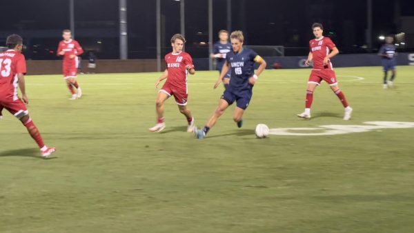 Wolfpack and Seahawks race downfield in soccer match (Jack Cooper/The Seahawk).